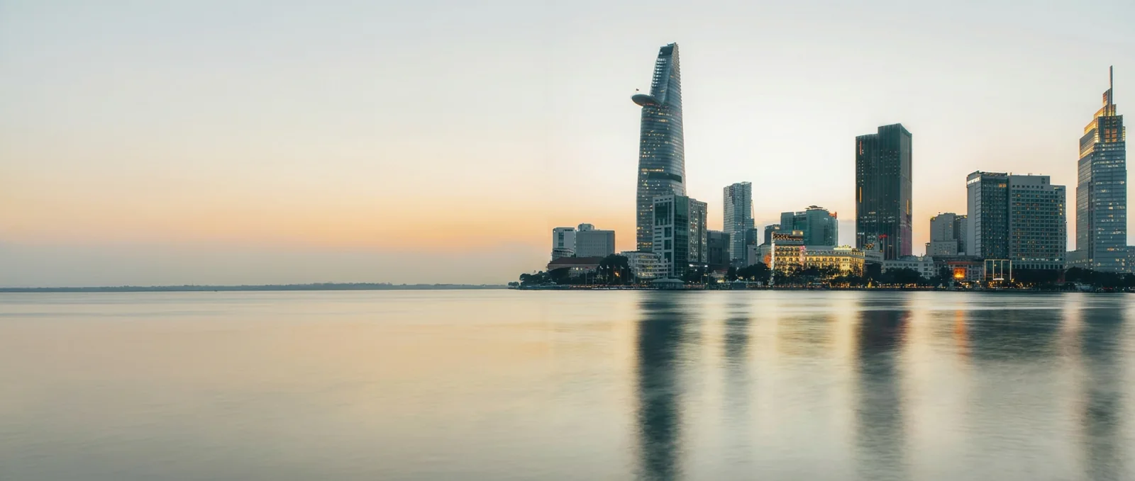 Ho Chi Minh City towers, with the Bitexco tower, across the Saigon River at dusk